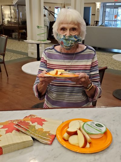 Senior woman with Caramel apple