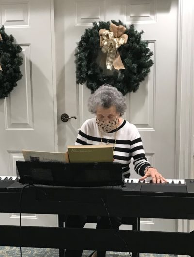 Senior woman playing piano